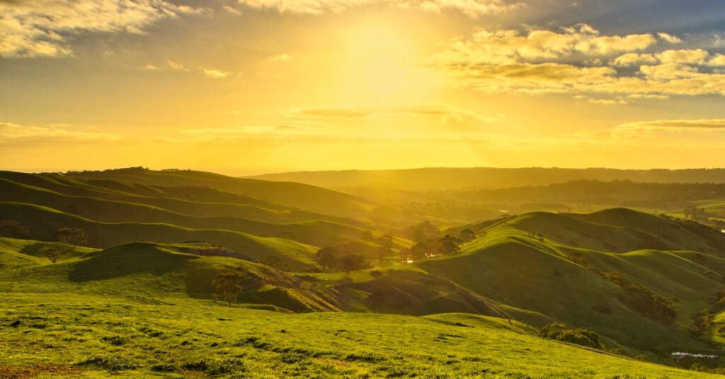 Beautiful sunrise over rolling hills in Yankalilla, South Australia, capturing nature's tranquility.